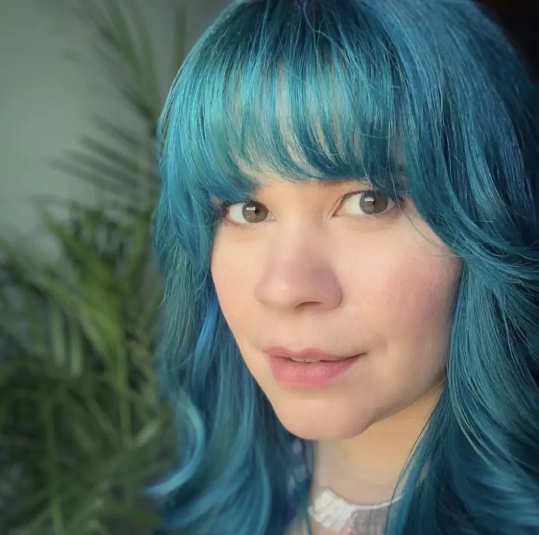 woman looking at the camera with blue hair